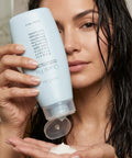 Quick Fix Leave In Hair Treatment Infuses Damaged Strands With Hella Hydration And Serious Shine For A Silky Smooth Finish Before Your Daily Blowout Session, applied to hand.