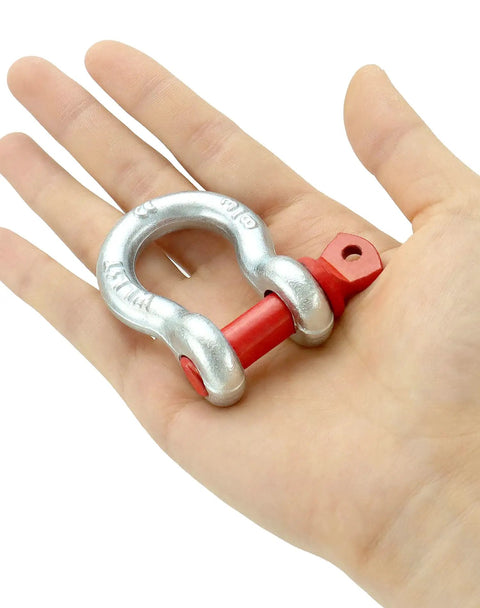 Hella Rugged Three Eighths Inch Galvanized Screw Pin Anchor Shackles Ten Pack Zinc Coated D Ring Connectors in hand.
