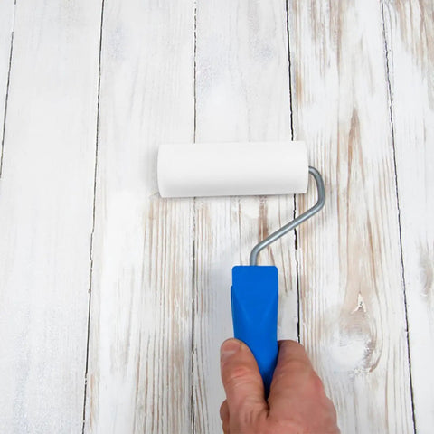 Pro Level Sponge Paint Rollers For Wall Texturing And Drywall Finishing Deliver Seamless Even Coverage Quick Swap Haul With Comfortable Grip Handles holding a small white roller.