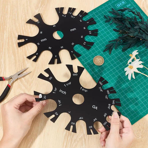 Acrylic Gauge Wheel Ring Sizer And Body Jewelry Checker Tool With Dual Inch And Metric Scale Chart built tough for piercers on workbench.
