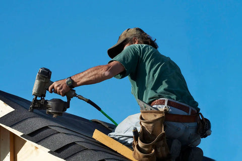 Roofer using 15 Gauge Wire Coil Roofing Nails With Full Round Head And Annular Ring Shank For OSB Or Plywood Roof Decks