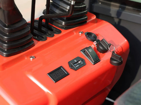Control panel of Compact 1.1 Ton Mini Excavator With Enclosed Cab and Hydraulic Thumb Attachment, showing levers and digital display.