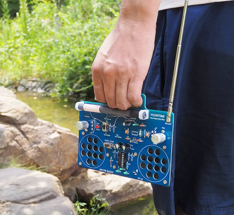 Person holding AM FM Radio Kit For DIY Soldering Projects And Electronics Teaching Hands On STEM Gift Dope Stereo Receiver