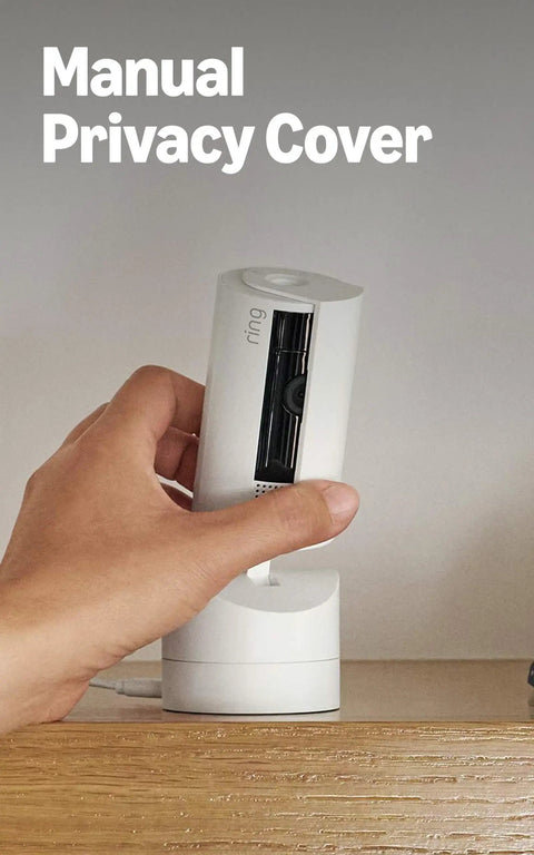 Manual privacy cover being held near the Sleek 360 Degree Pan Tilt Indoor Security Camera With Crisp Hd Video.