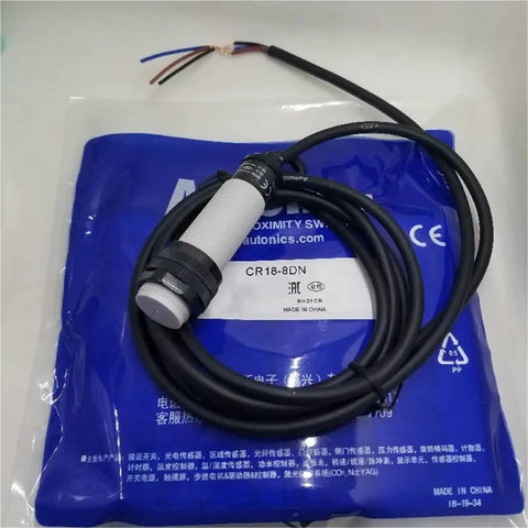M18 Capacitive Proximity Switch Sensor CR18-8DN shown with attached cable, designed for durable industrial automation use.