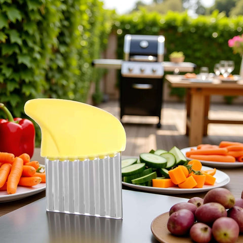 Crinkle cutter with yellow plastic guard on stainless steel ribbed body for vegetables