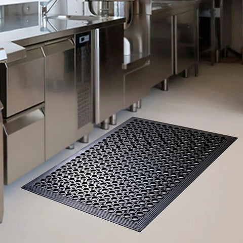 Anti Fatigue Outdoor Rubber Floor Mats 2 Pack For Commercial Kitchens And Restaurants Grippy Non Slip Drainage Mats For Indoor Outdoor Use Bar Garage 36x60 Inches Black in a stainless steel kitchen setting.