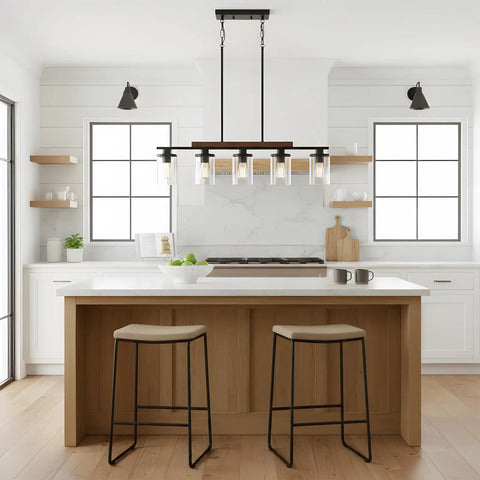 Modern Farmhouse 5 Light Linear Chandelier for Kitchen Island and Dining Room with Adjustable Rustic Pendant Light Black Metal Frame Real Wood Accent Clear Glass Shades Industrial Style Vibe hanging over kitchen island.