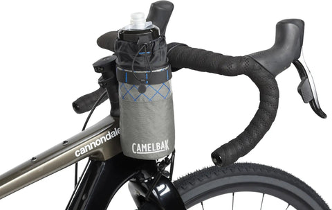 MULE Stem Pack For Bikepacking Secure Handlebar Storage For Snacks Phone And Essentials With Easy Access Cinch Closure Reflective Details Fits Podium Bottle GPS attached to bike handlebar.