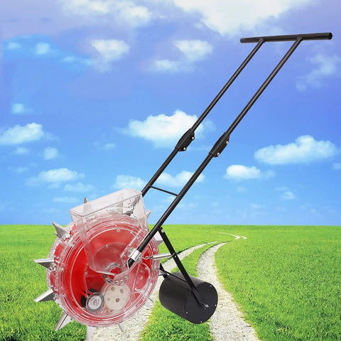 Metal Precision Garden Push Seeder With Clear Seed Storage Box Walk Behind Row Crop Planter in a grassy field