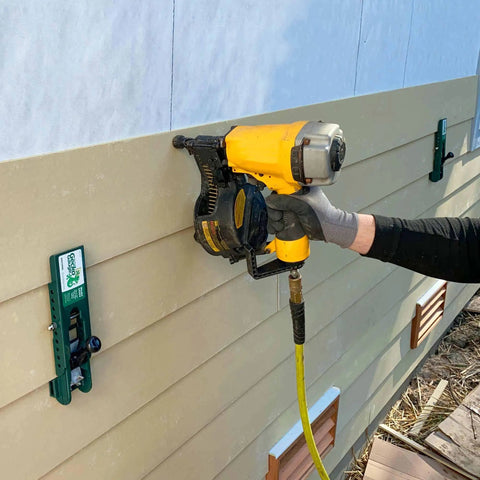 Worker using Gecko Gauge Siding Installation Kit For 5/16 Inch Fiber Cement And James Hardie Siding, Pro Grip Clamp for alignment.