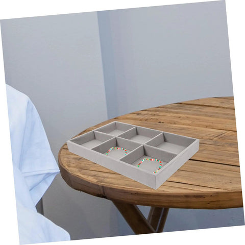 Three Piece Multi Grid Jewelry Organizer Trays Featuring Earring Stands Necklace Display Plates And Soft Velvet Ring Inserts To Make Sorting Your Bling A Breeze For Home Or Showroom Use on wooden table.