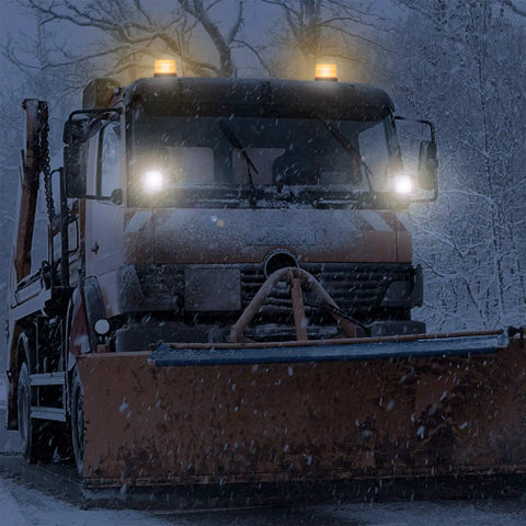 Top Tier Amber LED Strobe Light With Hella Bright Visibility And Rock Solid Magnetic Base For Zero Hassle Plug And Play Install On Work Trucks Or Trailers on snowplow at night.