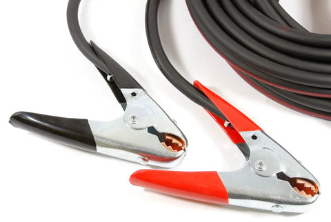 Twin Cable Battery Jumper Cables 16 Foot Long Heavy Duty Number 4 Copper Welding Cable With 500 Amp Clamps shown coiled on surface