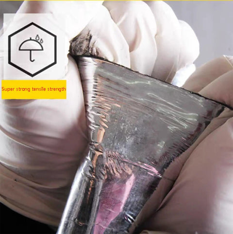Close-up of Top Shelf Self Adhesive Flashing Tape Waterproof Roof Underlayment Reflective Aluminum Foil Sealant showing strong tensile strength in hand.