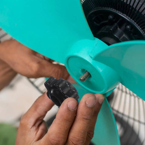 Person installing M8 Black Star Hand Knobs 32Mm Through Hole Brass Insert Screw On Clamping Handles 4 Pack on a machine.