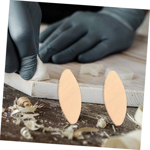 Close-up of woodworker using 100Pcs Wood Joining Biscuits Set For Rock Solid Furniture Joints Hardwood Joiner Accessories