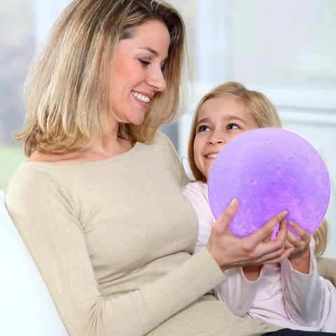 Mother and daughter holding Moon Glow 5.9 Inch Moon Lamp With 16 Colors Dimmable And Rechargeable Lunar Night Light