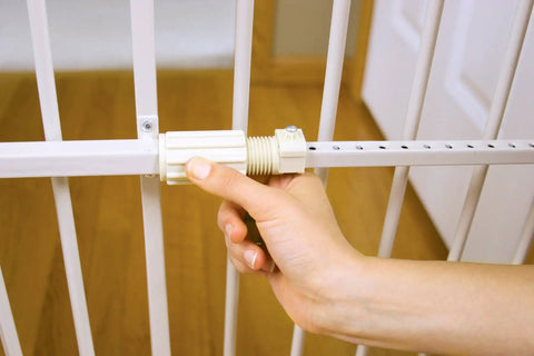 Hand adjusting no drill pressure mount metal dog gate for doorways and hallways expandable from 22 to 38 inches 18 inches tall