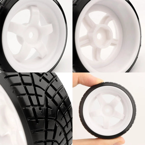 Close-up of 1/10 Scale RC Drift Tires With 12mm Hex Hub, slick design for on-road touring, showing tread detail and white rims.