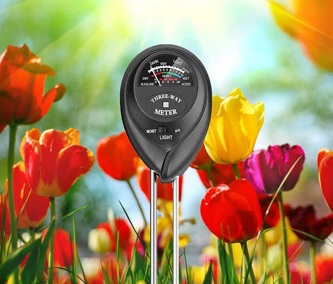 Soil Tester Plant Meter Light Tester 3 In 1 Function Soil Testing Kit in garden with tulips, measures moisture, light, pH