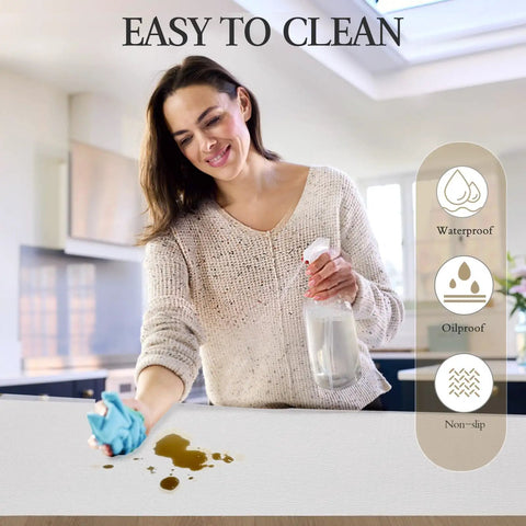 Premium White Non Adhesive Shelf And Drawer Liner For Kitchen Cabinets Pvc Based Non Slip Organizer Roll being cleaned with a cloth.