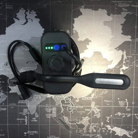 Kickass Slick IPX7 8.4V Rechargeable Battery Pack For Bikes And Cycling Headlamps featuring USB port and indicator lights.