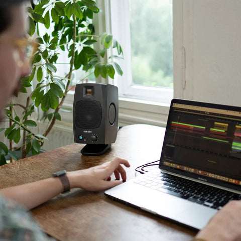 D3V Active Desktop Monitoring System Pair With USB C Connection for desktop studio use on desk with plant and laptop