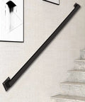 Industrial Stair Railing Kit Featuring Heavy Duty Galvanized Iron Pipe Handrail mounted on wall, ideal for indoor stairways.