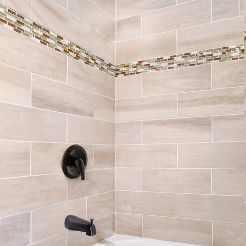 Middleton II Transitional Single Handle Shower Valve Trim with Escutcheon in oil rubbed bronze on tiled bathroom wall.