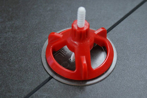 Red cap on tile from Tile Leveling System Starter Kit With 1/8 Inch Base Plates And Reusable Caps, Lippage Control For Fast, Precise Tile Installations, Easy Spin Design For Pros And DIYs