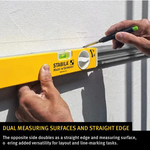 Heavy Duty Jamb Level Set Featuring 78 Inch Type 196 And 24 To 40 Inch Type 80 T Tool With Rock Solid Aluminum Frame, hand using level on wall.