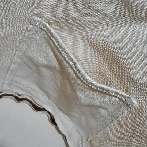 Close-up of a pocket on the Heavy Duty Canvas Bucket With Leather Bottom, 12 Inch Diameter, 1 Pocket, 100 Pound Load Rated Utility Bucket