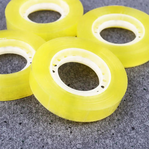 Dope 12 Pack 11mm x 30m BOPP Packing Tape in yellow, ideal for packaging and school use, displayed against a gray background