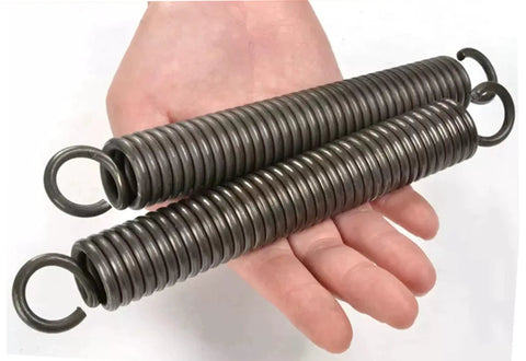 Premium Extension Springs With Dual Hooks Crafted From Rugged Stainless Steel shown in hand, ready for everyday car repairs and garage projects.