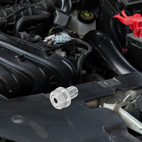 Top Notch Stainless Steel Oil Drain Bolt Kit With Sealing Gasket For Auto Engine Repair, Reliable Self-Tapping Thread Fix To Banish Leaks And Keep Your Ride Running Smooth As Butter. Stainless steel oil drain bolt kit shown on an engine bay cover.