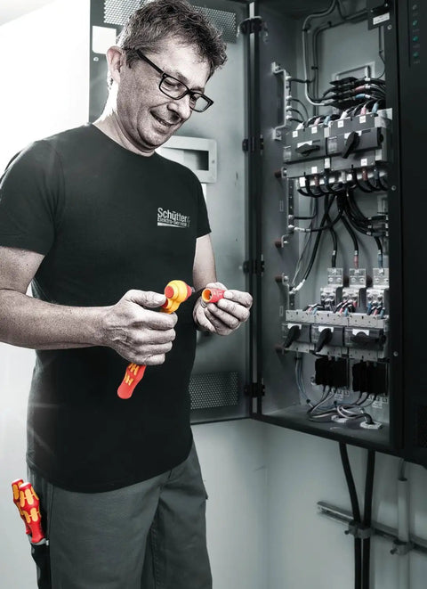 Electrician using Insulated Zyklop VDE Ratchet With Switch Lever Three Eighths Inch Drive 80-Tooth in power panel
