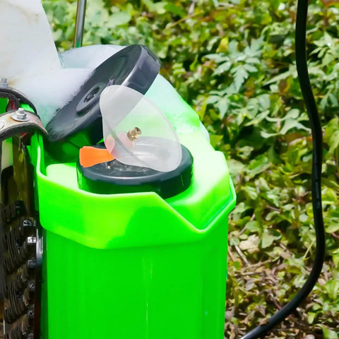 Close-up of backpack sprayer with a transparent windproof spray nozzle, featuring drift guard for agricultural electric sprayers.