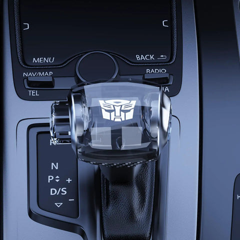 Touch Activated LED Crystal Shift Knob With Color Changing Breathing Light on automatic gear shifter in a car interior.