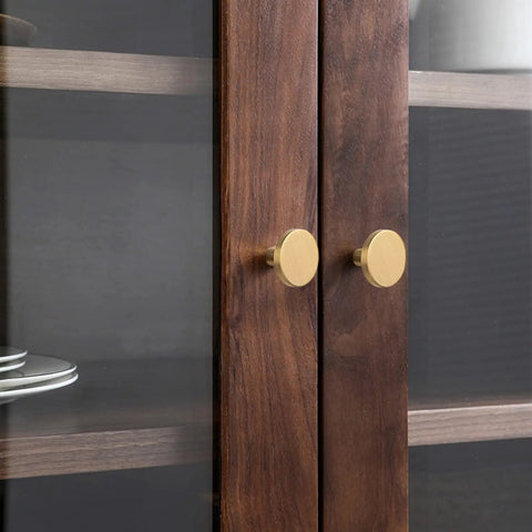 Heavy Duty Round Cabinet Knobs Four Pack Brushed Gold Zinc Alloy kitchen handle replacement on wooden cabinet doors.