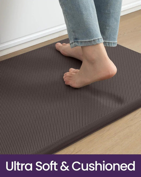 Person standing on Extra Long Anti Fatigue Kitchen Mat Cushioned Memory Foam Runner Rug 70 By 20 Inches Waterproof Non Slip Backing