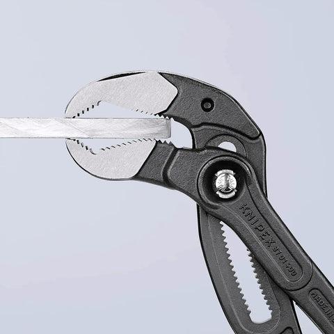 Water Pump Pliers Cobra XL 400 Mm Self Locking with Quick Push Button Adjustment gripping a flat metal piece.