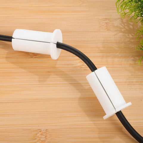 Slick Wall Cable Grommets Kit For Gaming Rigs And Home Theater To Hide Messy Wires With Durable Silicone Pass Through Holes That Protect Cables From Damage While Keeping Your Entertainment Setup Totally Neat And Super Easy To Install white silicone cable grommets on wooden surface