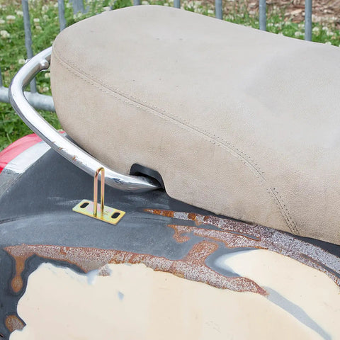 Close-up of a motorcycle seat with attached 4 Pack Metal Electric Bike Seat Lock Hooks For Electric Bikes And Scooters.