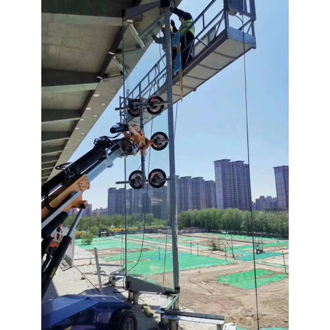 Workhorse Electric Glass Vacuum Lifter With Game Changing Suction Technology lifting large glass panel on construction site.