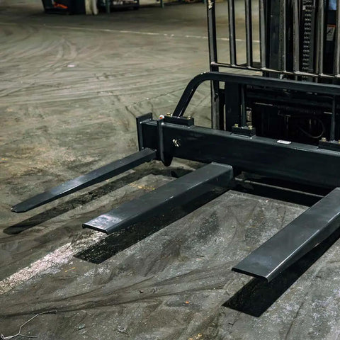 Top Shelf Adjustable Fork Spreader For Forklift And Telehandler. Forklift attachment with heavy-duty steel spreader bars.