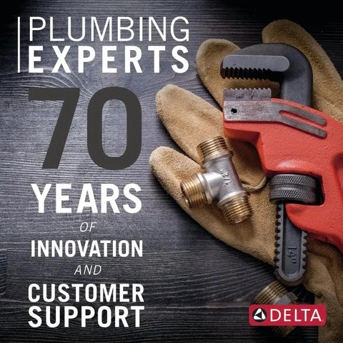 Plumbing experts celebrate 70 years of innovation with a red pipe wrench and gloves, showcasing Delta's commitment to customer support.