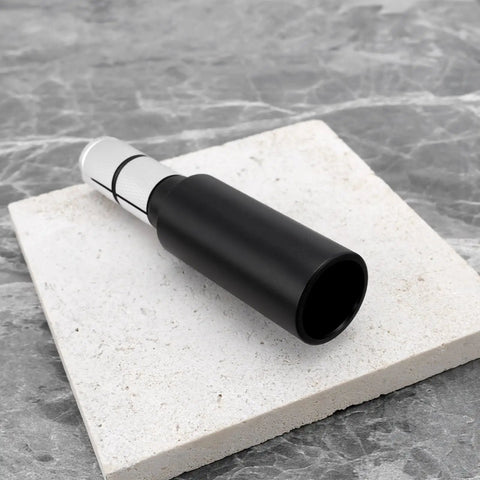Aluminum Bar End Extender For 15-20mm Ported Handlebars 91x22mm in Matte Black on stone tile surface