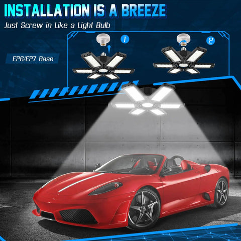 Two Pack 200W Ceiling LED Garage Lights With Six Adjustable Panels Deliver 20000 Lumens Of 6500K Daylight Brightness For E26 E27 Sockets High CRI Over 80 Ultra Wide Flood Lighting For Garage Shop And Workspace illuminating a red sports car in a garage.