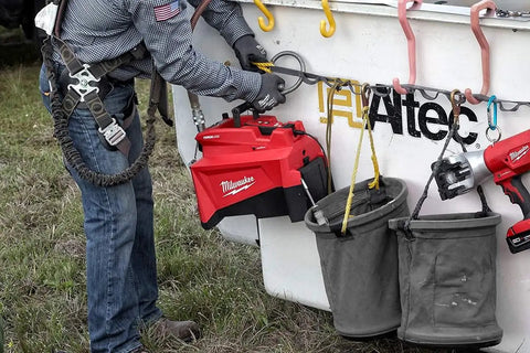 Top Shelf No Nonsense Cordless Hydraulic Pump Kit Featuring M18 Battery Technology And 10000 Psi Pressure used on a job site.